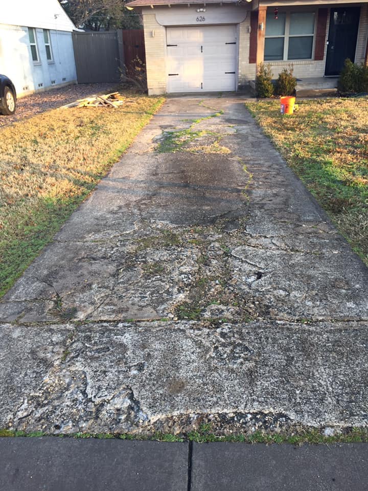 This is a cracked concrete driveway we repaired for a homeowner. 8 feet wide leading to a single car garage.